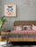 Pastel butterfly wall art styled above a contemporary bed in a minimalist bedroom