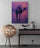 Black and purple sideboard with floor lamp on a white wall, camel and Egyptian pyramids wall art poster