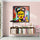 Frida Kahlo street art canvas above a designer wooden bookshelf filled with books and small decor accents in a clean, soft-toned modern interior