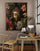 Framed Buddha poster in an office with wooden furniture and greenery, creating a serene, meditative workspace