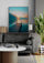 Elegant living room with wooden bridge over lake wall art in soft morning light, adding calm and serenity