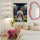 Framed personalized women’s soccer poster in an adult bedroom with pink and cream tones
