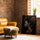 African woman canvas wall art for an industrial living room with a brick wall and a camel leather armchair