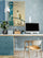 Framed Japanese Cat Cherry Blossom Poster Hanging Above a Wooden Desk with Blue Accents