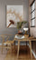 Large dandelion wall art above a bright, wood-accented workspace