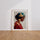 Poster Femme au foulard doré - Portrait lumineux et raffiné — Vierge - living-room — passe-partout blanc