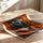 Poster Guépard - Regard fauve sur fond orange audacieux — Vierge - poster-enroullé — passe-partout blanc