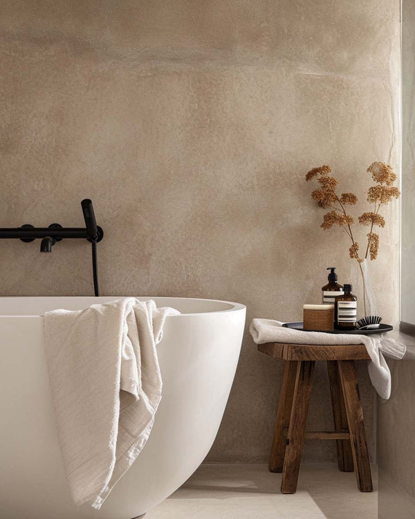 Bathroom with elegant bathtub and minimalist decor: An elegant bathroom featuring a modern bathtub and wooden decorative touches, providing a clean and relaxing space.