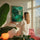 Emerald–turquoise abstract circle canvas hanging in a colorful living room, contemporary wall art