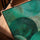 Modern abstract wall art with layered emerald and turquoise circles and subtle line textures