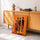 Tableau africain femmes stylisées silhouettes noires fond orange décoration salon moderne buffet rétro
