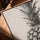 Black and white pineapple wall art in golden oak frame for living room