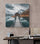 Rustic landscape canvas adds warmth to a modern home office, contrasting with the raw wall texture
