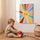 Tableau chambre bébé soleil souriant multicolore décoration murale éveil enfantin