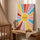 Tableau chambre bébé soleil souriant multicolore décoration murale éveil enfantin
