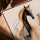 Black and gold abstract horse canvas wall art for a minimalist office