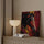 Abstract expressionist horse painting in red, yellow and black hanging above a sideboard in a contemporary living room