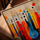 Abstract music canvas art with a blue string instrument and colorful notes, ideal for living room decor