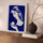 Modern wall art above sideboard: white female silhouette on deep blue, Matisse-style canvas
