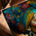 African woman portrait wall art with colorful headwrap in golden oak frame for living room
