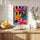 Vibrant colorful flowers canvas print with black-and-white stripes, statement wall art