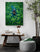 Framed wall art as the focal point above a rustic wood console, with a striped pouf and natural decor, creating a serene, elegant reading nook