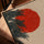Japanese red sun and pine branches artwork with tea bowls, oak frame on table, warm neutral tones