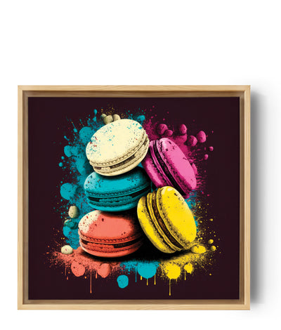 Un tableau avec macarons bleu, rose jaune orange et blanc disposé l'un au dessus de l'autre. Des éclaboussures jaillissent des macarons. Les couleurs sont vives et le fond est noir.