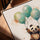 Panda with pastel balloons wall art in a golden oak frame - living room decor