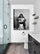 Monkey on the toilet artwork hung by the bathroom toilet adds a unique touch to the decor