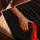 Scandinavian living room wall art, painting of a woman's hand holding a red high heel stiletto