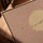 Blush pink moon and birds canvas with golden oak frame on a living room table, serene decor