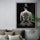 Minimalist black and white wall art of an elegant woman from behind