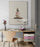 Zen wall art with stacked stones and Japanese calligraphy, styled in a modern home office with wooden chair, designer lamp, light desk and colorful storage drawers