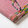Close-up detail of a colorful horse canvas on pink, with thick textured paint and an artistic finish