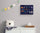 Kids’ space-themed wall art hanging above a dresser in a nursery