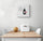 Small kitchen wall art hanging above the dining nook