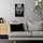tableau lion noir et blanc habille est accroché dans un salon moderne gris. Au-dessus d'un buffet en bois