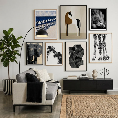 Black and white posters and prints in a monochrome living room – gallery wall decor by MyselfMonArt