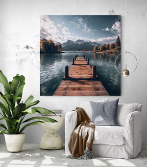 Tropical living room with a lake canvas creating an oasis of serenity