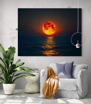 Sunset wall decor over sea for a cozy living room with green plant and orange and purple accents