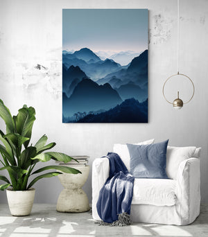 Minimalist reading nook enhanced by our misty mountain canvas