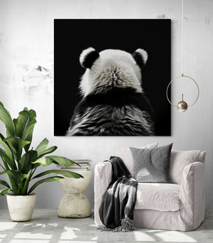 living room with a reading nook enhanced by a panda art print, elegance and simplicity