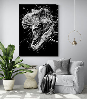 living room with a comfortable chair, grey cushion and throw, modern side table, large green plant, hanging light, light grey wall, large dinosaur canvas.