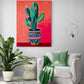 pièce de vie, fauteuil confortable, coussin et plaid vert, table d'appoint, grande plante verte, mur gris clair, lumière en suspension, tableau cactus rouge.