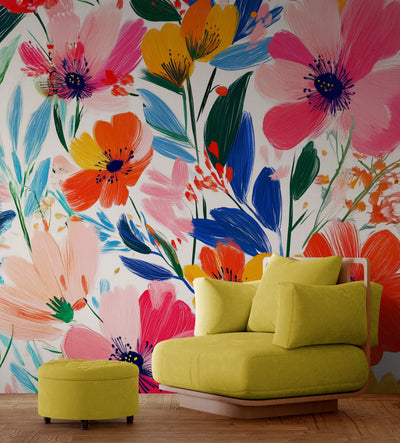 Un motif floral éclatant avec des fleurs aux teintes vives de rose, orange et jaune, accompagnées de feuillages verts et bleus. Le fond clair met en valeur l’effet peint à la main, ajoutant une touche artistique et moderne.