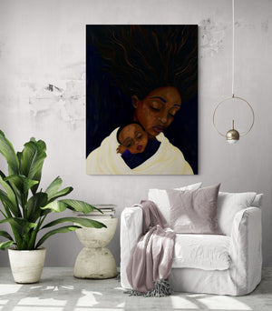 A large art canvas with dark shades of maternal love enhances the warm ambiance of this reading nook