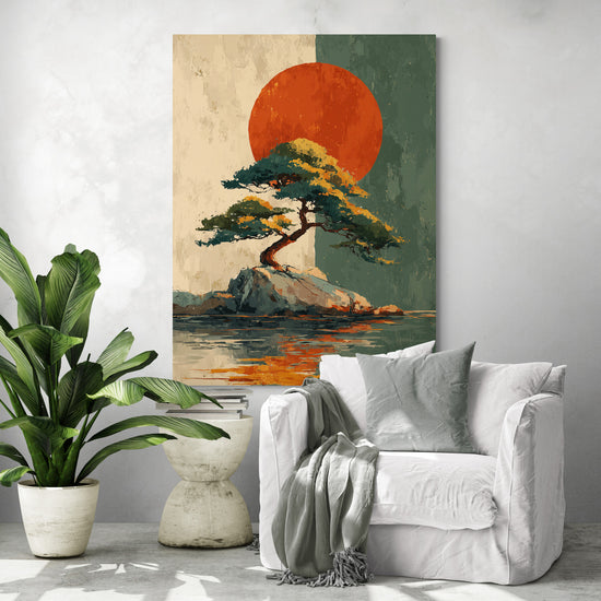 Japanese wall art depicting a lone pine on a rock facing a big red sun, displayed in a modern living room with white chair, gray cushion, decorative throw, green tropical plant, and small concrete design table.