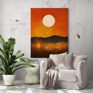 Sunset painting hung in a modern living room with light furniture and a white chair surrounded by greenery, creating a soothing atmosphere