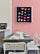 Cozy kitchen with a pastel pink wall, dark wood dining table, and white chairs